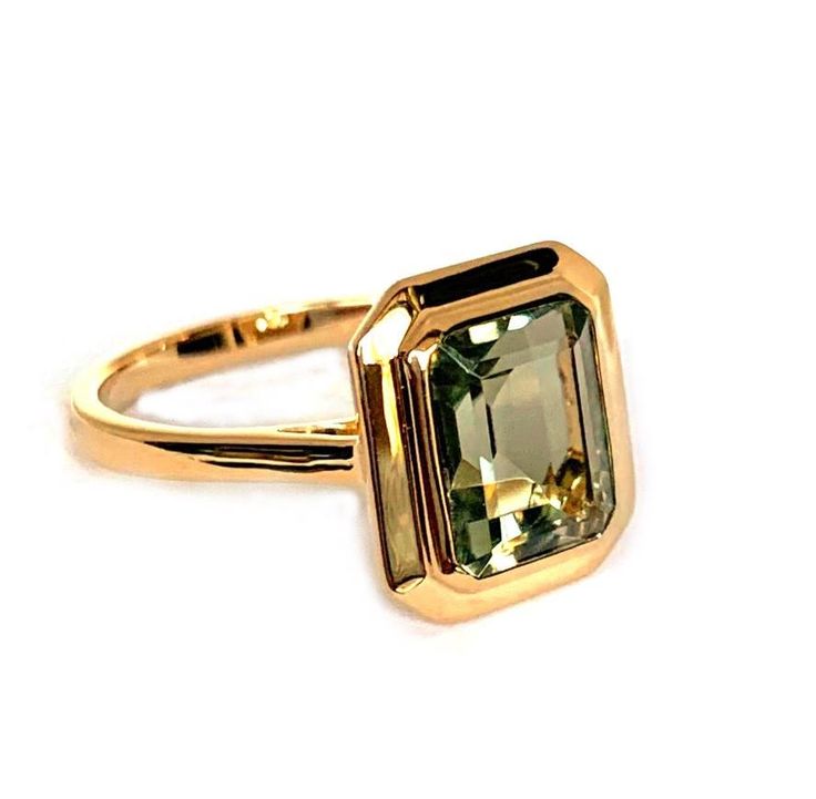 emerald cut green amethyst set in 14k gold bezel set f matching earrings ME2496GAM and pendant MP3478GAM available m Please Inquire For Other Color Stone Centers m Stone Information: 1 11 x 9 mm emerald cut green amethyst 4.57 cts Gold: white, yellow and rose gold In Stock: 1 available in 14K yellow gold Luxury Green Jewelry With Bezel Setting, Timeless Green Jewelry With Bezel Setting, Modern Emerald Cut May Birthstone Jewelry, Emerald Cut 14k Gold Jewelry, Luxury Faceted Emerald Cut Jewelry, Modern Jewelry With Rectangular May Birthstone, Formal Emerald Cut Faceted Jewelry, Modern Green Jewelry With Prong Setting, Timeless Rectangular Gemstone Jewelry