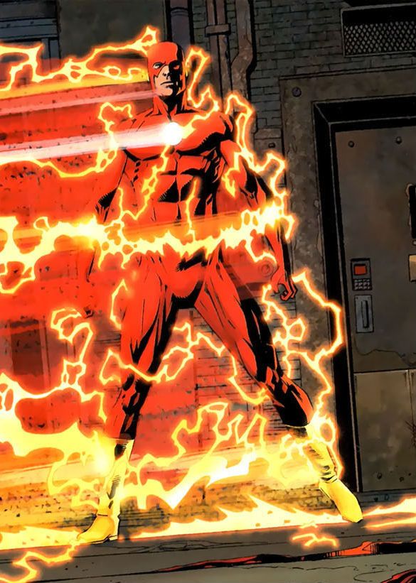 a man in red and yellow costume standing next to a building with fire coming out of it