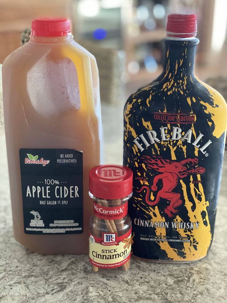 the ingredients to make apple cider are sitting on the counter top next to each other