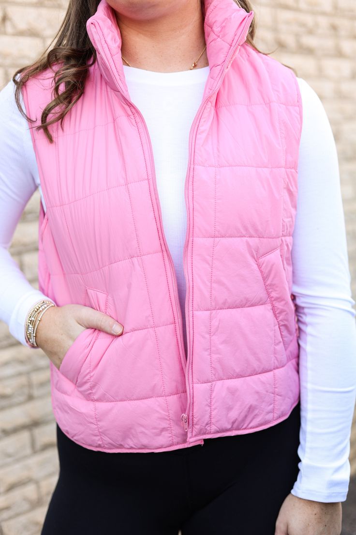 Our "Kasie Vest" is a light pink vest that zips up the front and has front pockets. Our model is wearing a size Small. Trendy Spring Vest With Zipper Closure, Pink Vest Outerwear For Spring, Casual Pink Vest Outerwear, Pink Sleeveless Outerwear For Fall, Sleeveless Pink Outerwear For Fall, Casual Spring Vest With Zipper Closure, Trendy Pink Vest For Spring, Casual Pink Sleeveless Outerwear, Pink Sleeveless Vest With Pockets