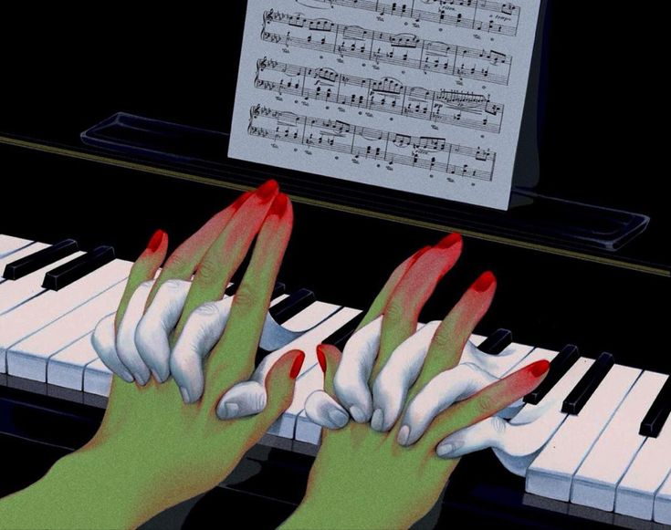 two hands with red fingernails are playing the piano