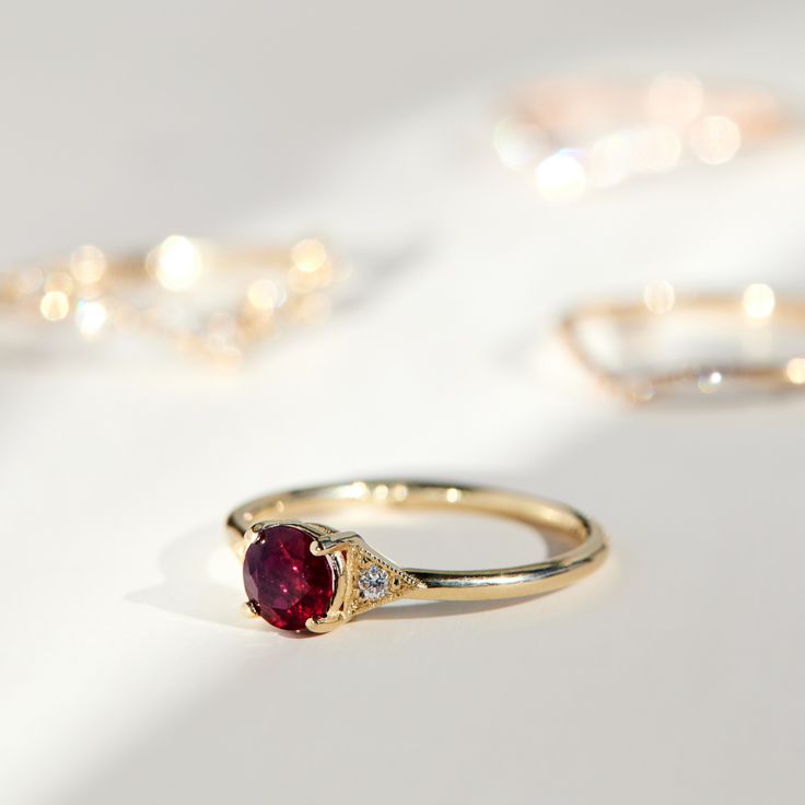 A romantic ruby, set between Jennie Kwon’s signature milgrain-edged triangles. Classic, with modern touches: a 21st century ring. See "Details" for item specifics (carat weight, metal, etc) Luxury Ruby Diamond Ring With Accent Stones, Luxury Trillion Cut Ring With Accent Stones, Ruby Ring With Accent Stones For Promise, Fine Ruby Jewelry For Wedding And Promise Occasions, Luxury Ruby Round Cut Rings, Luxury Red Rings With Rose Cut Diamonds, Classic Ruby Promise Ring, Luxury Round Ruby Promise Ring, Luxury Ruby Ring With Center Stone For Promise