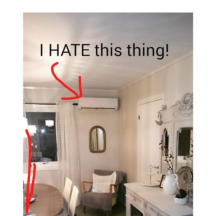 a room with a table, chair and mirror in it that says i hate this thing