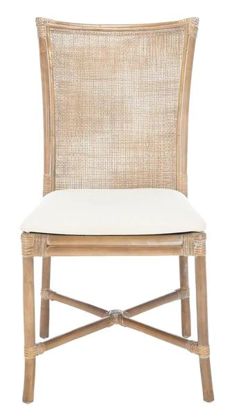 a chair with a white cushion on the seat and backrest, made out of wicker