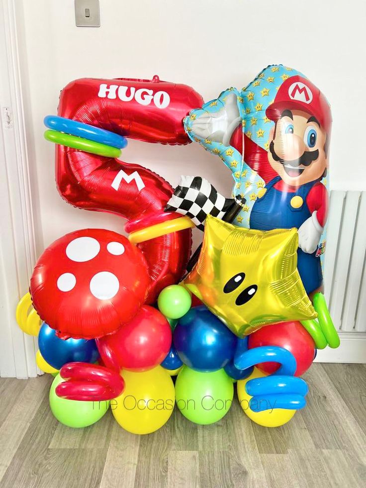 balloons and heliums in the shape of mario birthday decorations