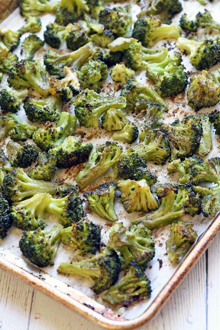 a casserole dish filled with broccoli florets