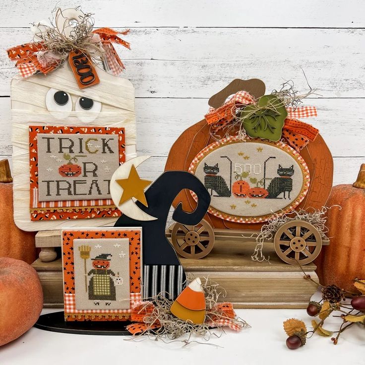 some pumpkins and other decorations on a table