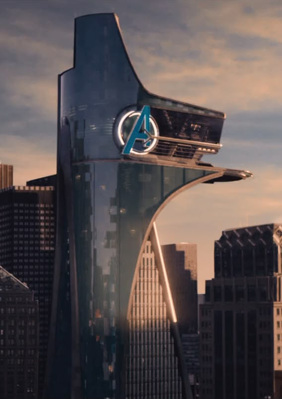 the avengers logo is on top of a futuristic building