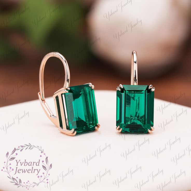 ❤Jewelry Details -Gold Type : Solid 10K Gold / Solid 14K Gold / Solid 18K Gold (Choose One in Material Option) -Center Stone: Lab Created Emerald 8*10mm, Approximately 3.24ct*2pcs Color: Green--- 5A Clarity: VVS Cut: Emerald Cut / 3EX Earring Width: 8mm Earring Length: 17.5mm SKU: YE0086 ~*-*~Purchase Guarantee: - All our jewelry is handmade, and each process is refined. - 14 Day Refund Guarantee. - All our products are Free Shipping. - Free Gift Box&Packing. ~*-*~Please contact us if you need service: 1. Ring Resizing. 2. Metal Change(PT950/10k/14k/18k White/Yellow/Rose Gold). 3. Engraving ring (less than 10 letter). 4. Accept customization. We believe that our quality, attention to detail, design and customer service make us stand out from the competition. If you have any questions, plea Dainty Earrings For Wedding With May Birthstone, Classic 14k Gold Earrings For May Birthstone, 14k Gold Jewelry With Emerald Cut Matching Earrings, 14k Gold Emerald Cut Matching Earrings Jewelry, Gold Emerald Cut Earrings For Anniversary, 14k Gold Earrings For May Birthstone, Emerald Cut 14k Gold Jewelry With Matching Earrings, Dainty Earrings For Wedding, May Birthstone, Elegant May Birthstone Hoop Earrings