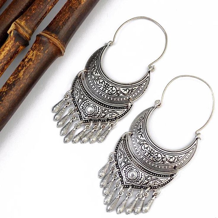 Greek Goddess Boho Earrings Silver Metal Tassel Drop Earrings, Bohemian Drop Earrings With Fish Hook, Metal Fish Hook Earrings, Ornate Antique Silver Metal Earrings, Bohemian Silver Tassel Earrings, Bohemian Dangle Chandelier Earrings With Intricate Design, Bohemian Chandelier Earrings With Oxidized Finish For Festival, Bohemian Sterling Silver Chandelier Earrings For Festivals, Nickel Free Silver Chandelier Earrings For Festivals