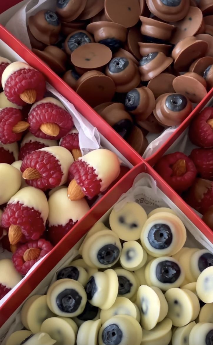 three boxes filled with different types of desserts