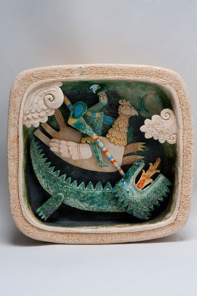 a ceramic bowl with an image of people riding on a boat in the water and two alligators