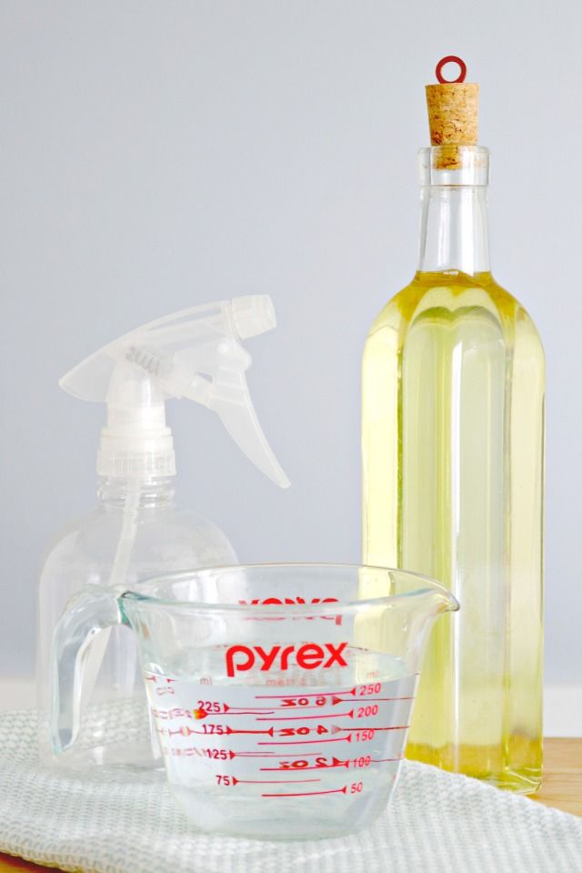 a glass measuring cup with a bottle of pyrex next to it