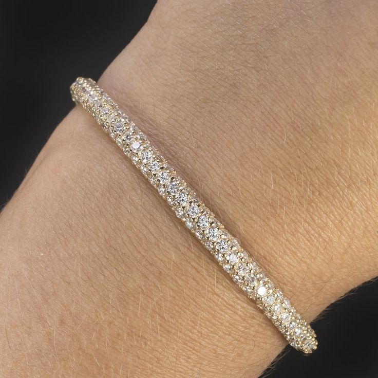 Why we love it: This vintage diamond bracelet is encrusted with 5 carats of diamonds and has a luxurious, substantial feel. Highlights: - Very well maintained estate piece - 5 carats of bright white and eye clean diamonds - Satisfying weight at 12.2 grams - Hinged bangle design with very secure clasp and double safety locks - Solid 14k yellow gold Dimensions: 4.6mm in width. Inside dimensions 2.25 x 2.15 inches An appraisal is available upon request. All of our pieces come with a 30 day return p Solid Gold Bangle Bracelet, Vintage Diamond Bracelet, Solid Gold Bangle, Pave Bangle, Bangle Design, Edwardian Style, Big Diamond, Bangle Designs, Gold Bangle Bracelet