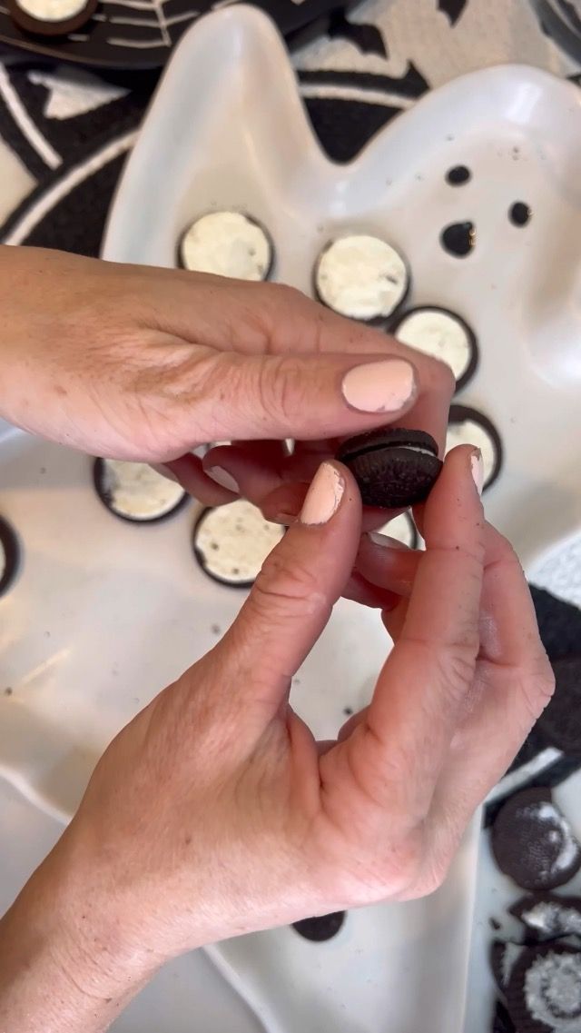 a person holding a cookie in their hand