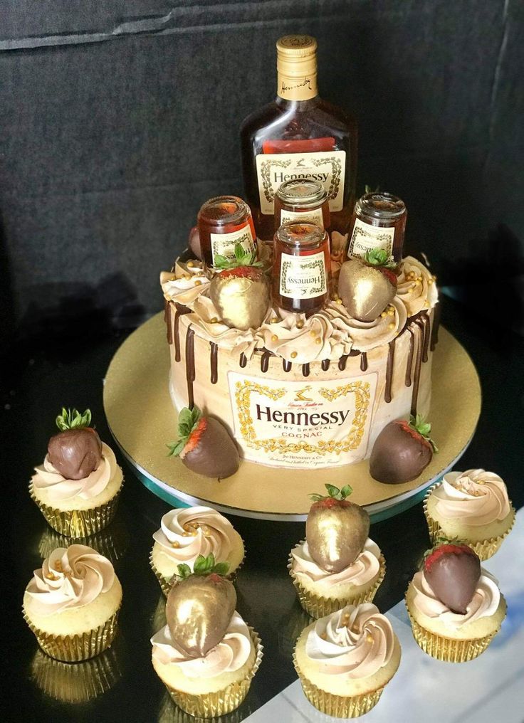 cupcakes and bottles of whiskey on a table