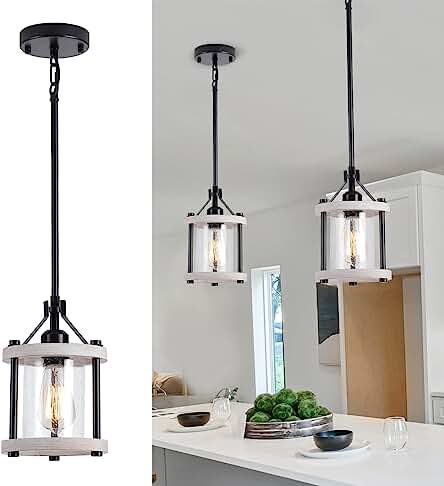 three lights hanging over a kitchen island in front of a white counter top and cabinets