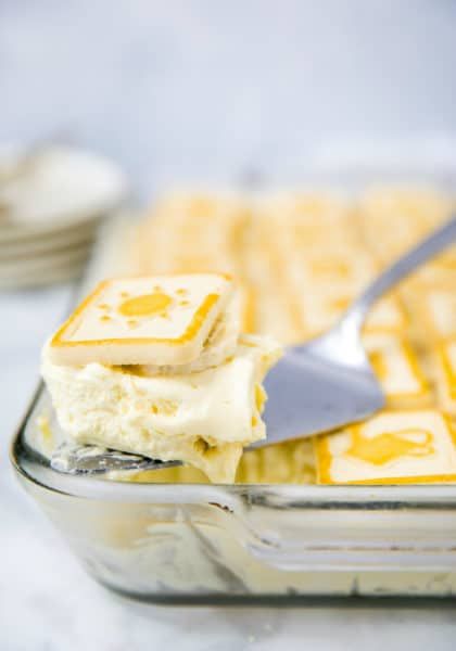 a banana pudding in a glass dish with a spatula on the side that says best banana pudding ever