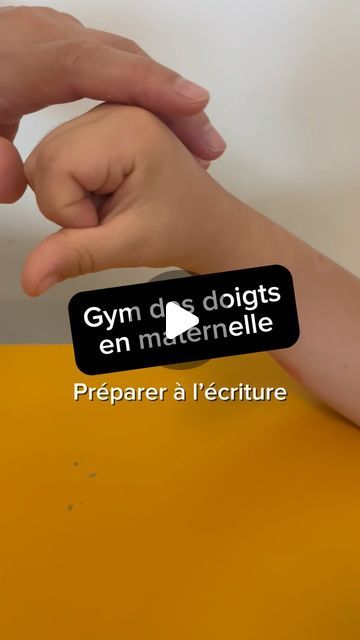 a person holding another persons hand on top of a yellow surface with the words gym and doits en merrimelle