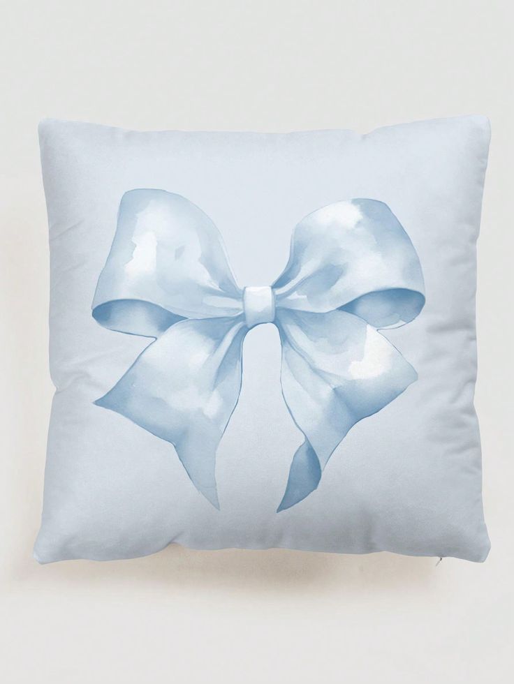 a blue pillow with a large bow on it