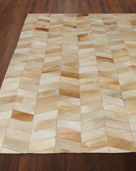 an area rug made out of wood blocks on a wooden floor with hard wood floors