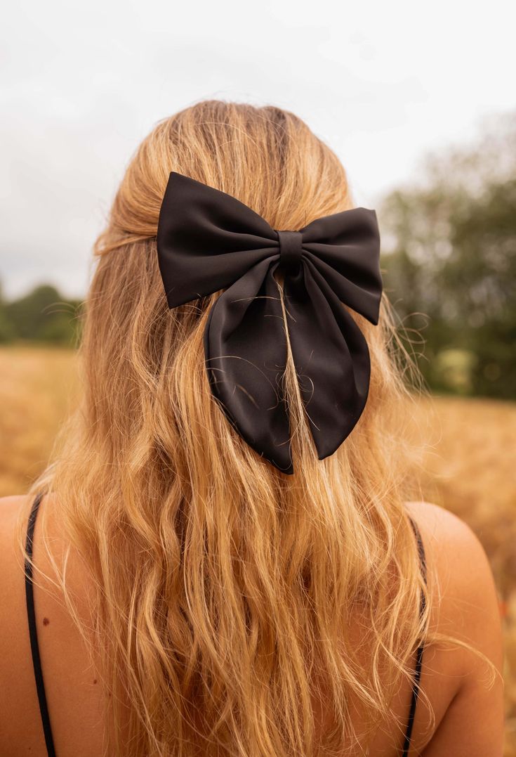 The Black Falla Bow is a stunning 6.3 inch hair clip, perfect for adding a touch of elegance and sophistication to any hairstyle. Colors: black - beige Chic Black Hair Accessories For Evening, Chic Party Hair Accessories With Satin Bow, Elegant Black Hair Accessories With Decorative Bow, Black Elegant Formal Hair Accessories, Elegant Black Formal Hair Accessories, Elegant Black Ribbon Hair Accessories, Elegant Black Hair Accessories With Bow, Chic Black Headband Hair Accessories, Chic Black Headband