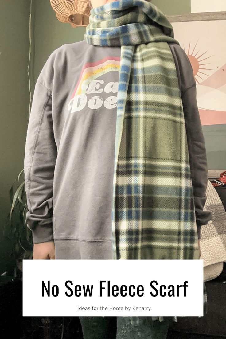 a person wearing a plaid scarf with the words, no sew fleece scarf