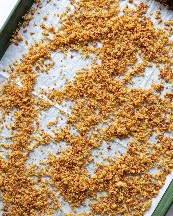 some food that is laying out on a baking sheet and in a green dish pan