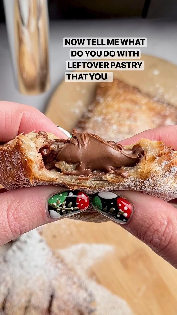 a person holding a piece of bread with chocolate frosting on it and the words, now tell me what do you do with leftover pastry that you?