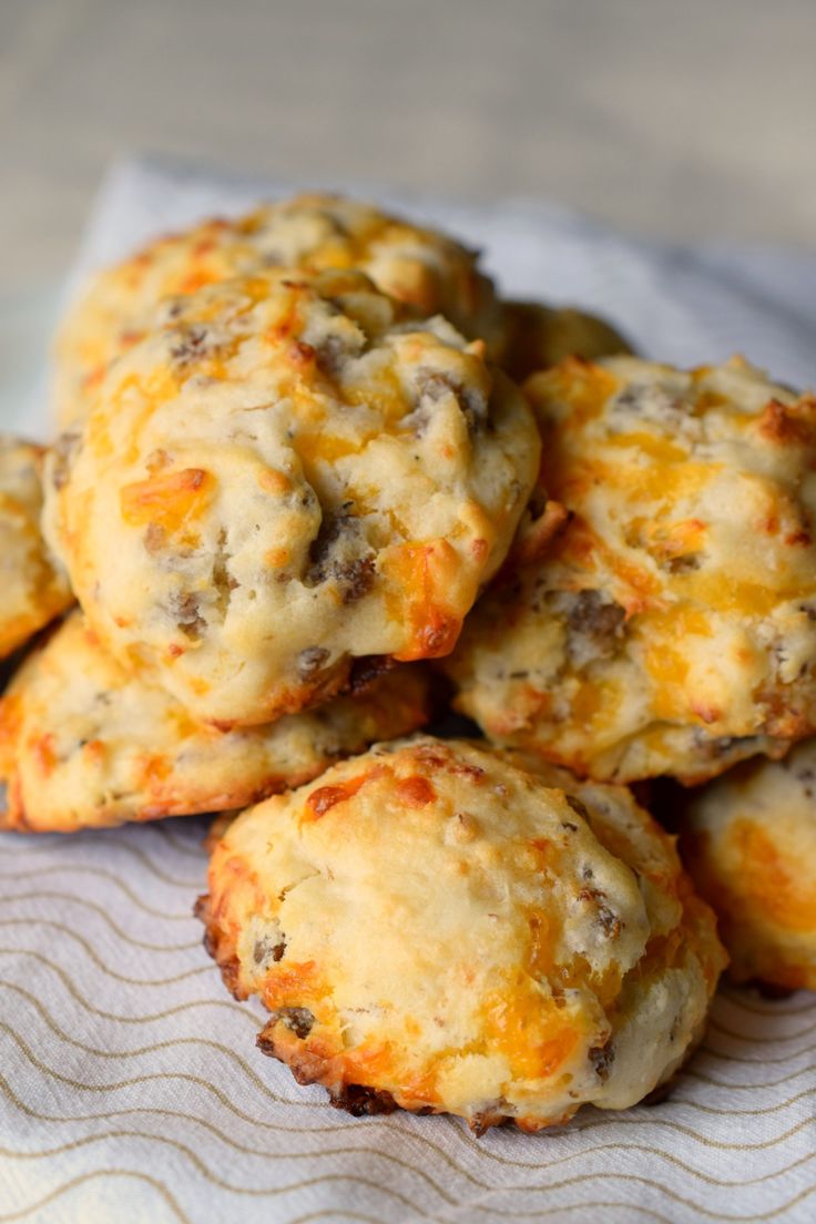 cheesy biscuits are piled on top of each other