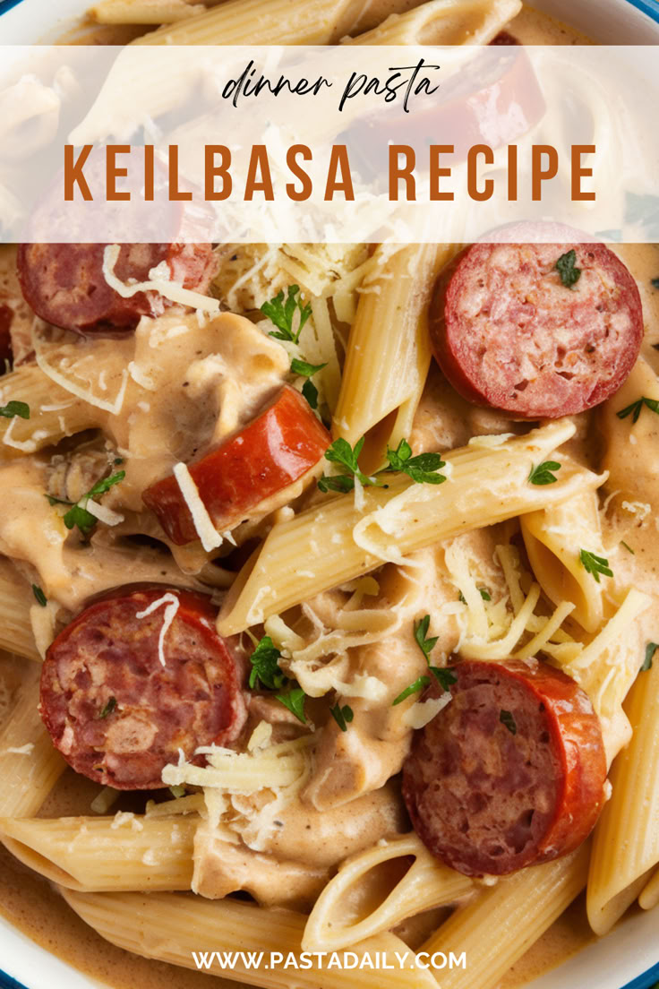 a pasta dish with sausage, tomatoes and parmesan cheese in a white bowl