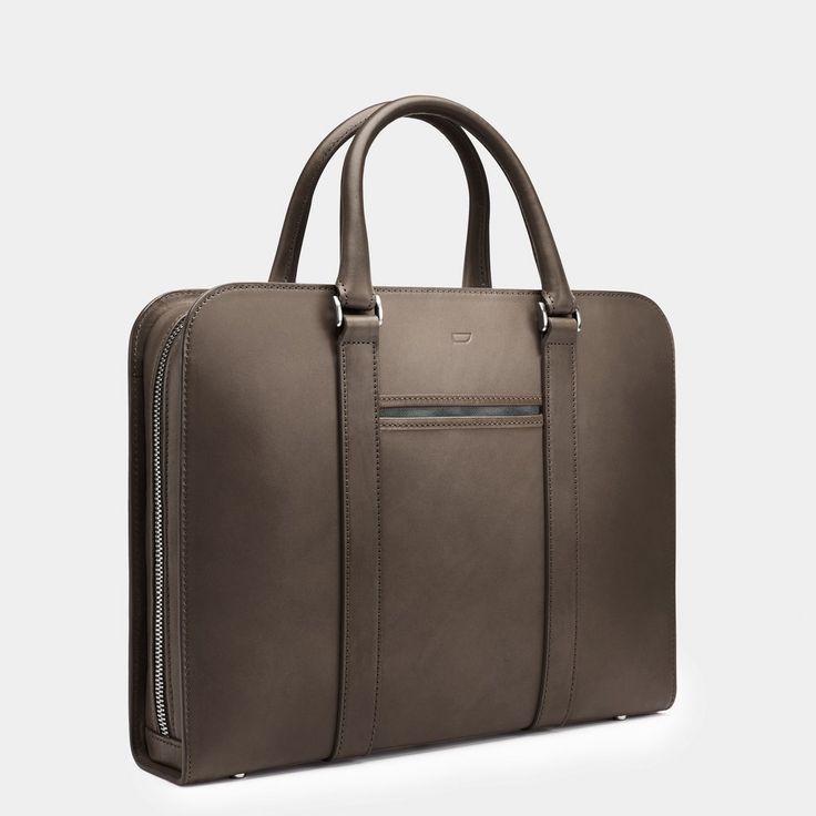 A contemporary case acting as personal portfolio; an everyday companion for the modern gentleman. Modern Rectangular Laptop Bag For Travel, Modern Travel Laptop Bag Rectangular Case, Modern Travel Briefcase Rectangular Case, Modern Travel Briefcase With Top Carry Handle, Modern Rectangular Travel Satchel, Modern Rectangular Satchel For Business Trips, Modern Rectangular Satchel For Everyday Use, Modern Brown Briefcase With Top Carry Handle, Modern Briefcase With Luggage Sleeve For Work