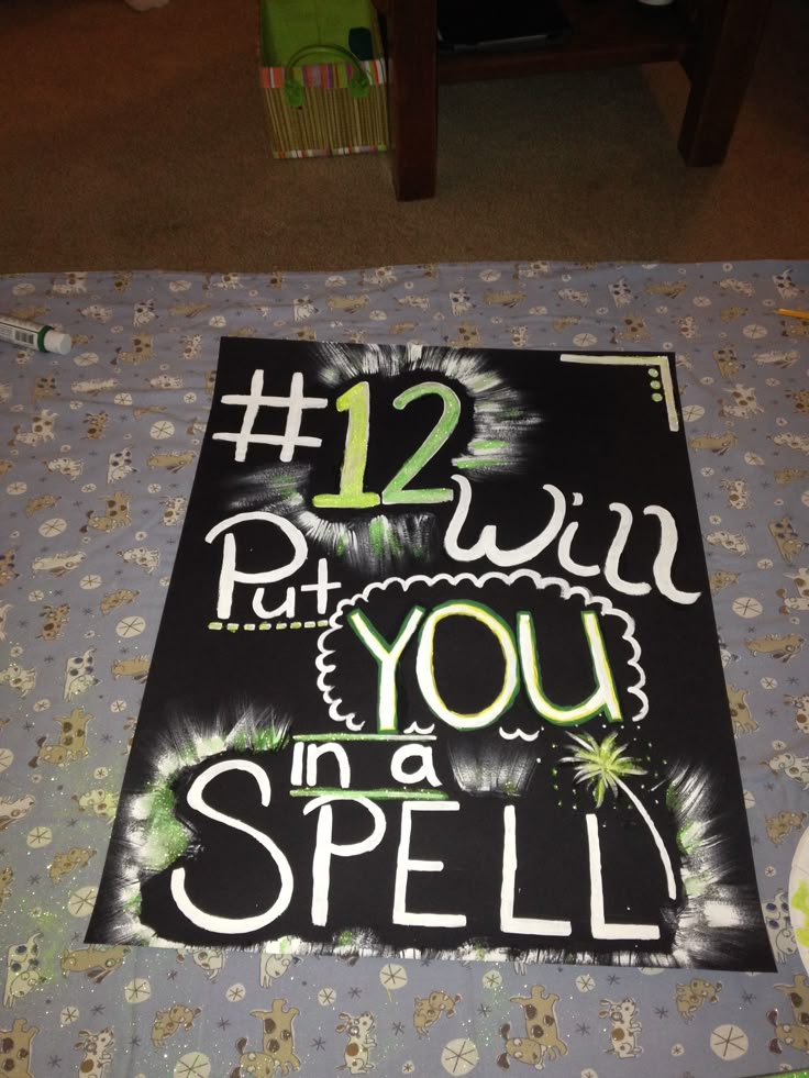 a sign that says 12 win put you in a spell on the ground next to a table