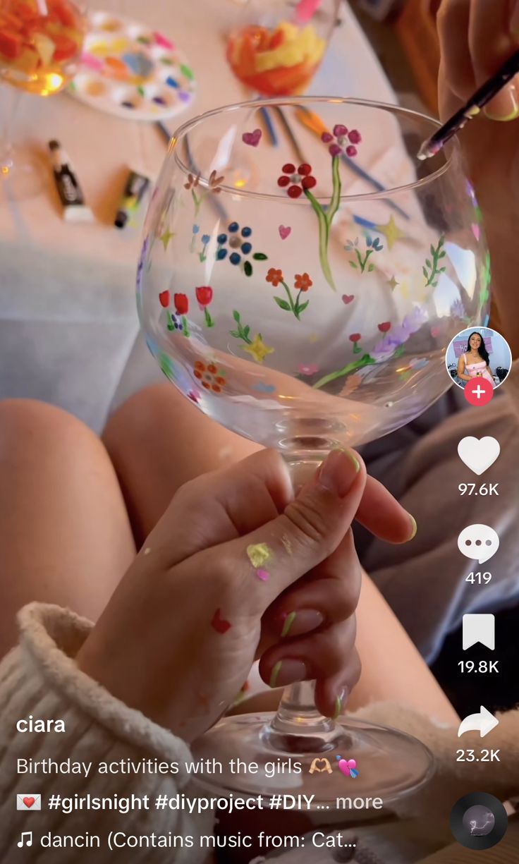 a person holding a wine glass in their hand with the caption birthday activities with the girls