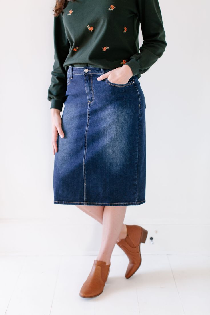 Trends come and go but denim remains a wardrobe staple! Crafted from a comfortable stretch denim in a timeless dark blue wash, the Wren will be your new go to skirt! The details include a traditional button and fly closure and functional pockets. And the very best part - this modest denim skirt comes in three lengths for you to choose from! Exclusively designed by us for you. 95% Cotton 5% Spandex Wash Cold Gentle Cycle Hang to Dry Low Iron if Needed Model A Height 5'5" | Wearing Size 2 - 23" Le Modest Denim Skirts, Denim Skirts Knee Length, Olive Skirt, Distressed Denim Skirt, Wren, Knee Length Skirt, Knit Skirt, Dark Denim, Main Street