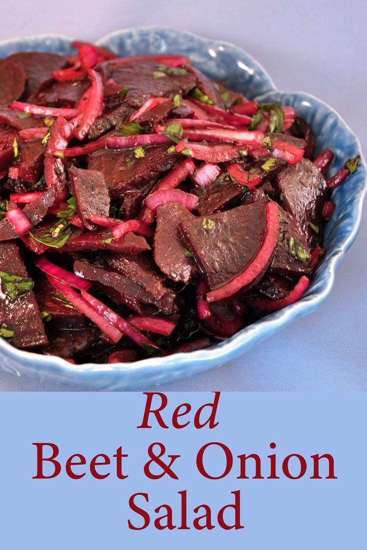 red beet and onion salad in a blue bowl with the words, red beet & onion salad