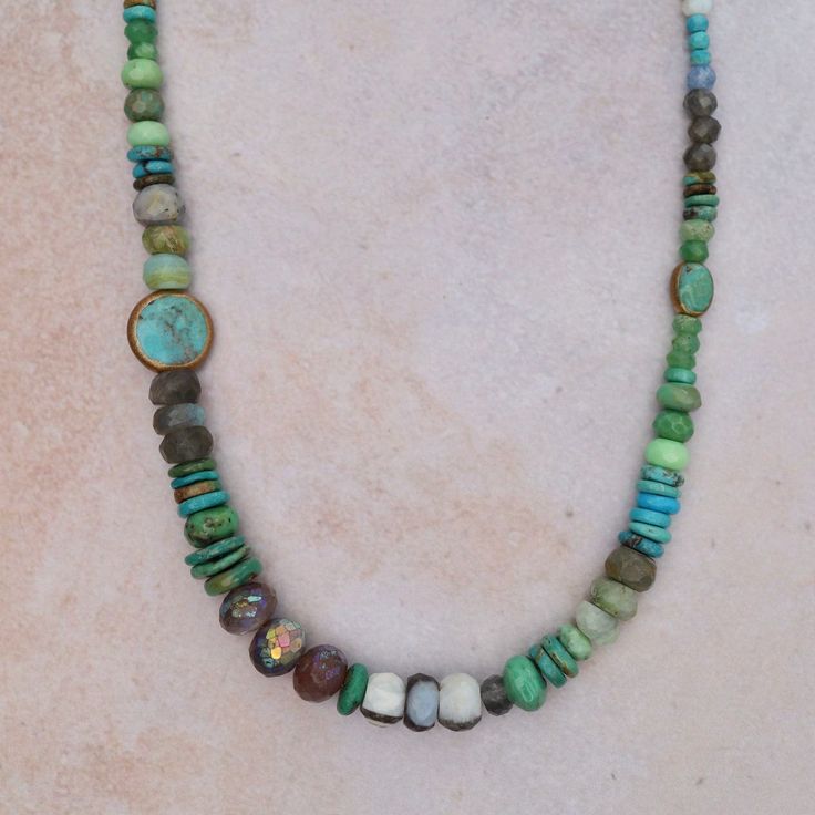 Opal, labradorite, roman glass, blue moonstone, turquoise, brass, neon apatite, chrysocolla, and one ruby Adjustable 16-18" All natural stones slight variations in color will occur Handmade in CT Riverstone Jewelry Turquoise Labradorite Spiritual Necklace, Spiritual Turquoise Labradorite Necklace, Green Labradorite Necklaces With Natural Stones, Bohemian Gemstone Rondelle Necklaces, Bohemian Rondelle Gemstone Necklaces, Earthy Turquoise Jewelry For Healing, Bohemian Turquoise Chrysoprase Necklace, Bohemian Labradorite Beaded Necklace, Bohemian Labradorite Beaded Necklace With Natural Stones