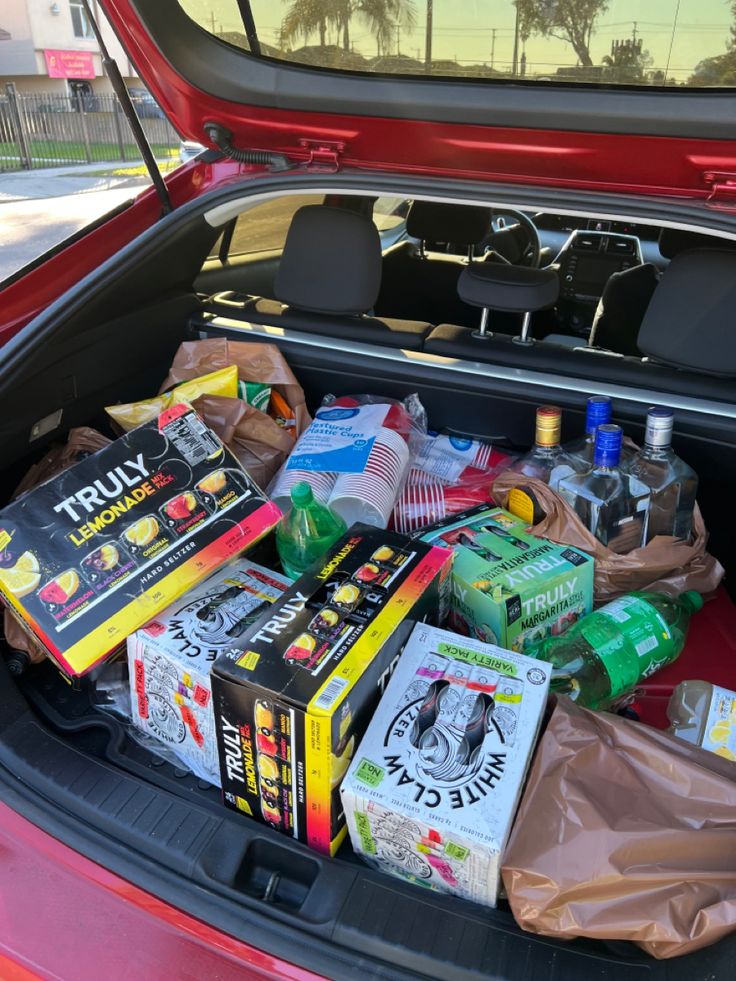 the trunk of a car filled with food and drinks