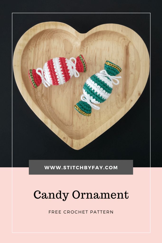 candy ornament on a wooden heart with text overlay that reads, candy ornament free crochet pattern