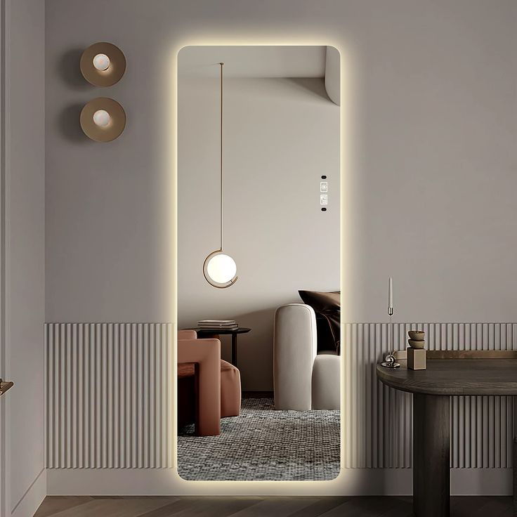 a room with a mirror, table and lights on the wall next to each other