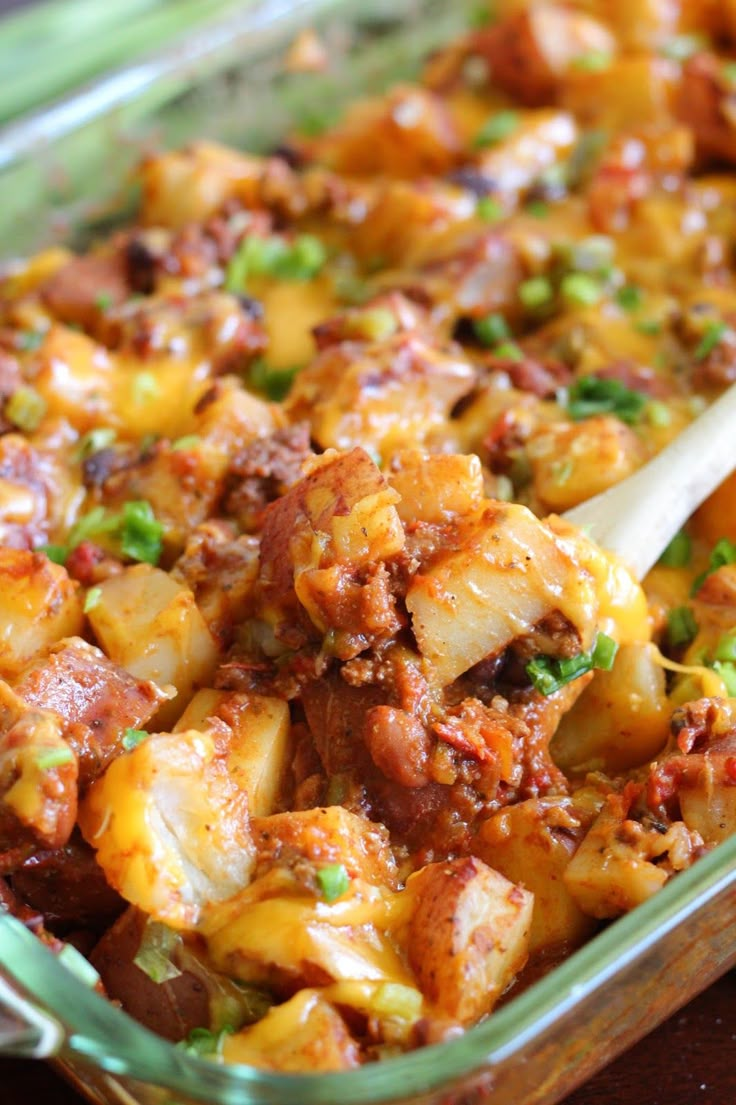 a casserole dish with meat and vegetables in it, ready to be eaten