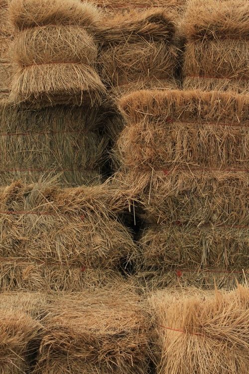 several bales of hay stacked on top of each other