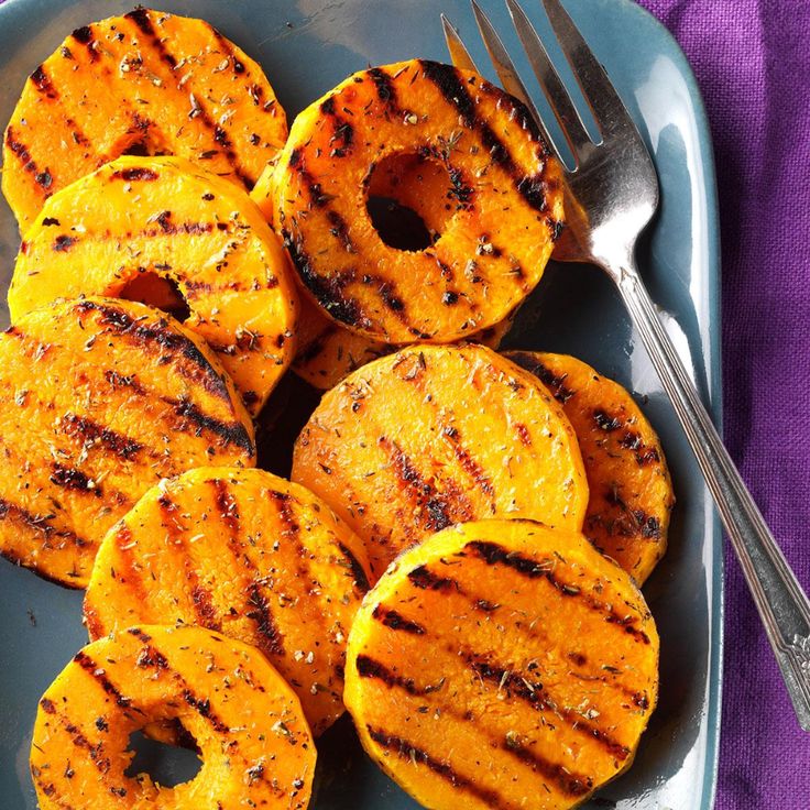 grilled sweet potatoes on a plate with a fork