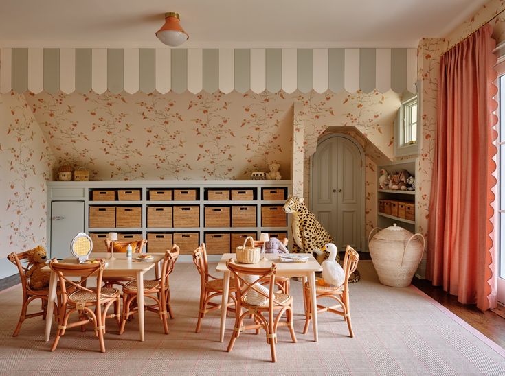 a dining room with striped walls and wooden chairs in front of the table set for four