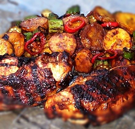 a close up of food on a plate with meat and vegetables in it's center