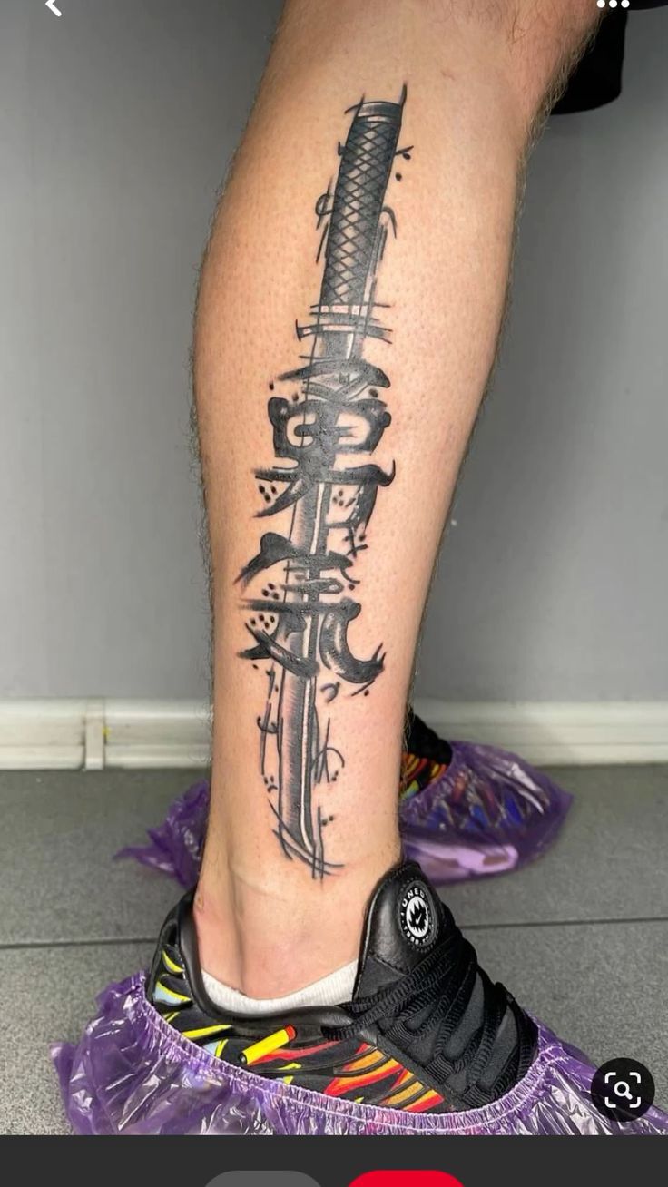 a person with a tattoo on their leg holding a knife