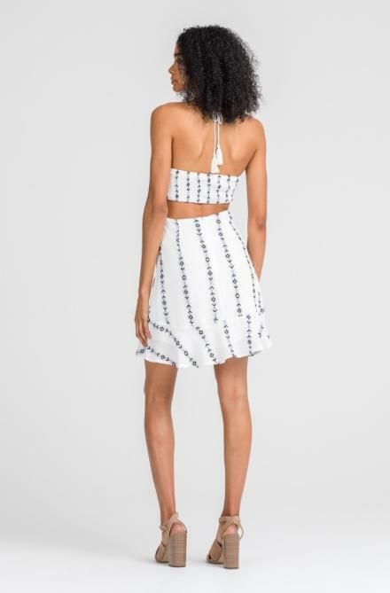 Final Sale - Get it before it's gone! The Lush Light and Day White Cross Front Halter Dress will be there for all of your summertime events! This sexy, geo-embroidered (with navy and dove blue embroidery) white sundress has an adjustable cinched cross-front cutout top (for the perfect fit), with a tassel tie halter bodice. The matching skirt has a ruffle trim. Lined. DETAILS & FIT Body Skimming Fit. Rayon/Poly. Hand wash cold. Imported. Spring Beachwear Mini Dress, Lined, Beach Season Mini Sundress For Date Night, Fitted Strapless Sundress For Beach Season, White Summer Mini Dress For A Day Out, Fitted Sundress For Date Night In Summer, White Mini Dress For Summer Day Out, Bohemian Lined Sundress For Summer, Lined Beachwear Sundress For Summer, Lined Beachwear Mini Dress For Summer