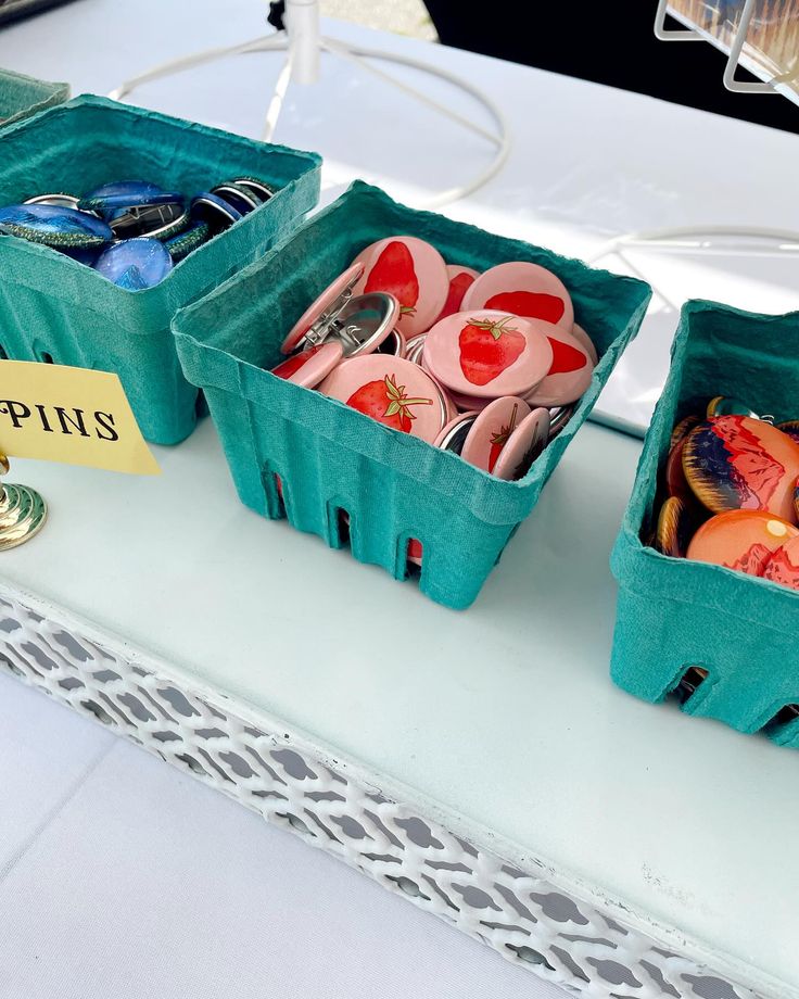 two baskets filled with different types of items on top of a table next to each other