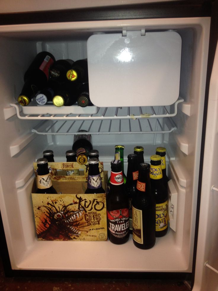 an open refrigerator filled with lots of beer