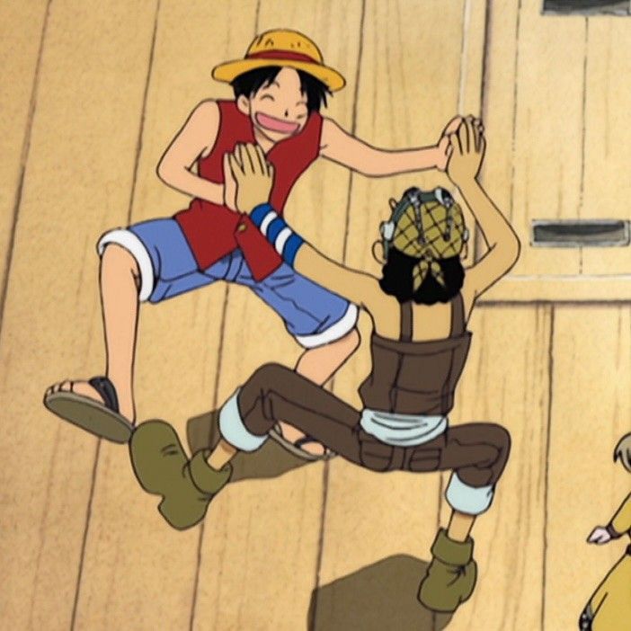 an animated image of two people playing with each other on a wooden floor in front of a door